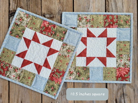 Christmas mini quilts with red patchwork star in center surrounded by cordinating patchwork squares.