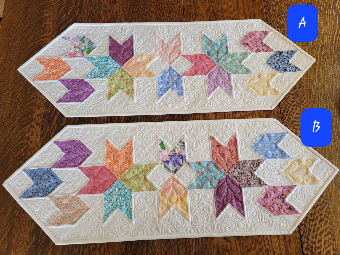 Spring tulip table runner in pastel patchwork on white background. Two runners shown with variations in color placement. Labeled A and B, for choosing at checkout.
