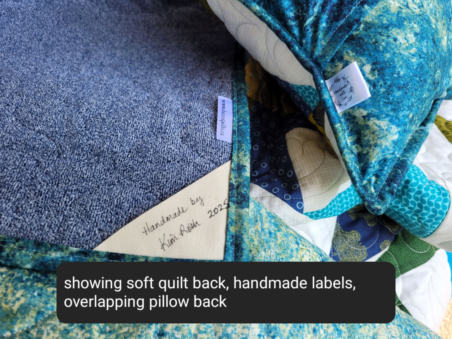 Showing soft quilt back with handmade labels and the back of the pillow.