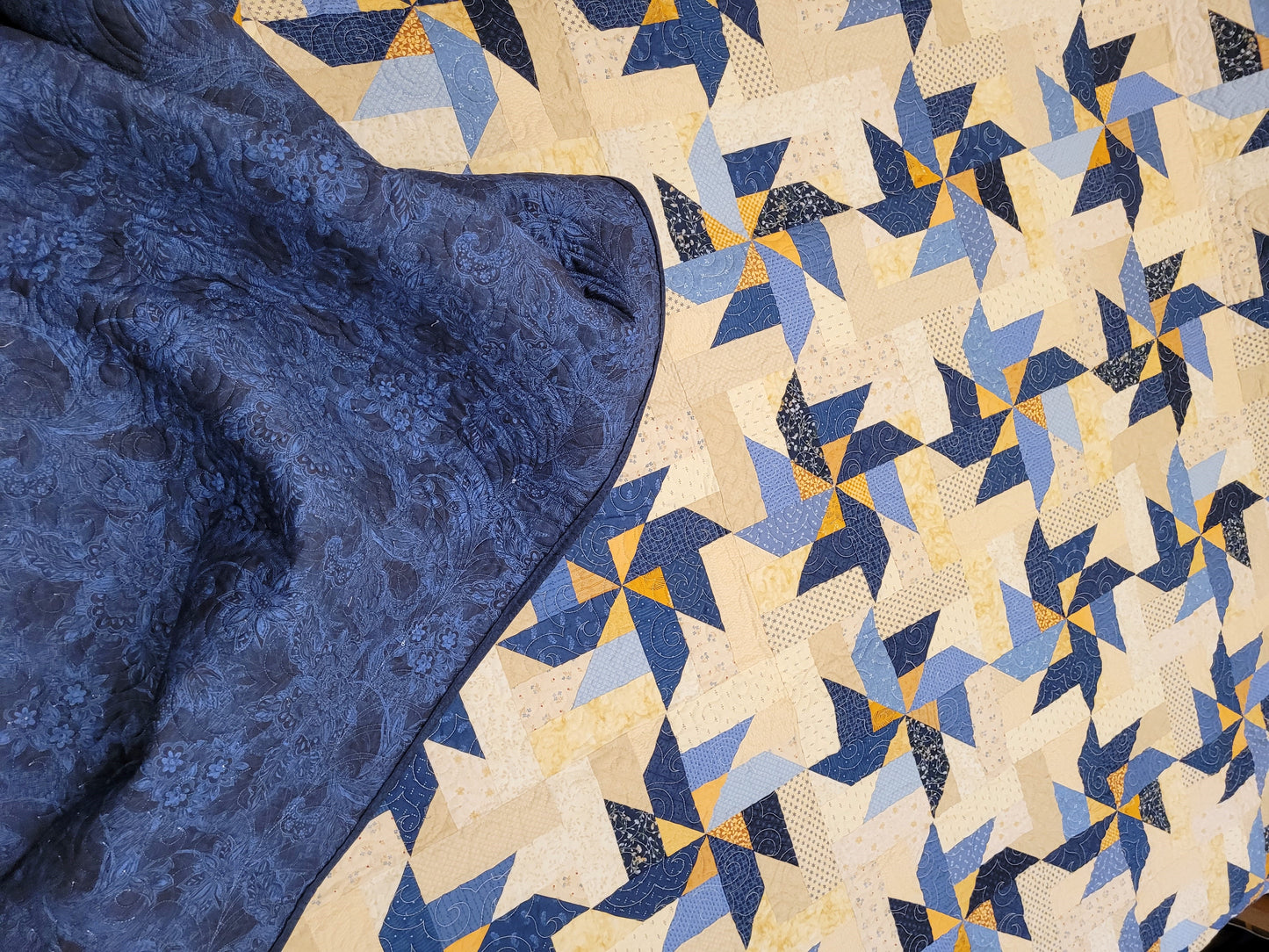 king size bed quilt in scrappy blue pinwheels