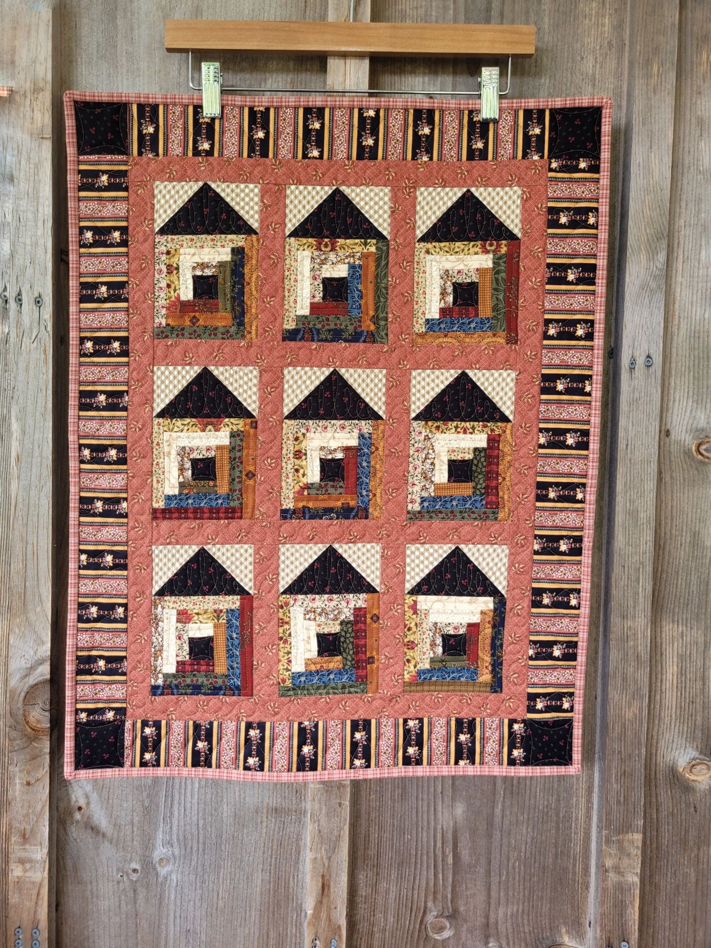 Quilt with geometric pattern on a wooden surface