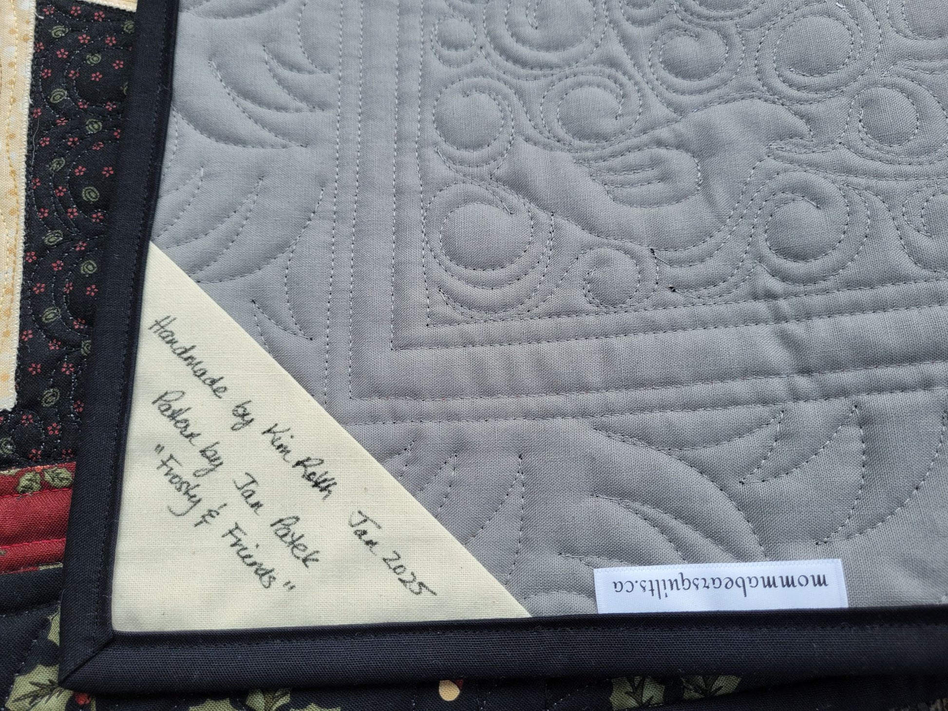 Showing handmade label on back of Frosty & Friends quilt.