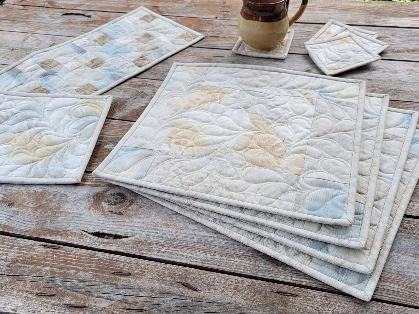 quilted dining table mat set with coasters, runner and hot mat