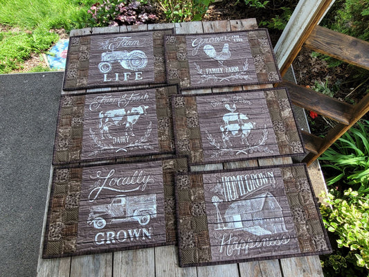 Six large placemats in brown tones with farm theme pictures