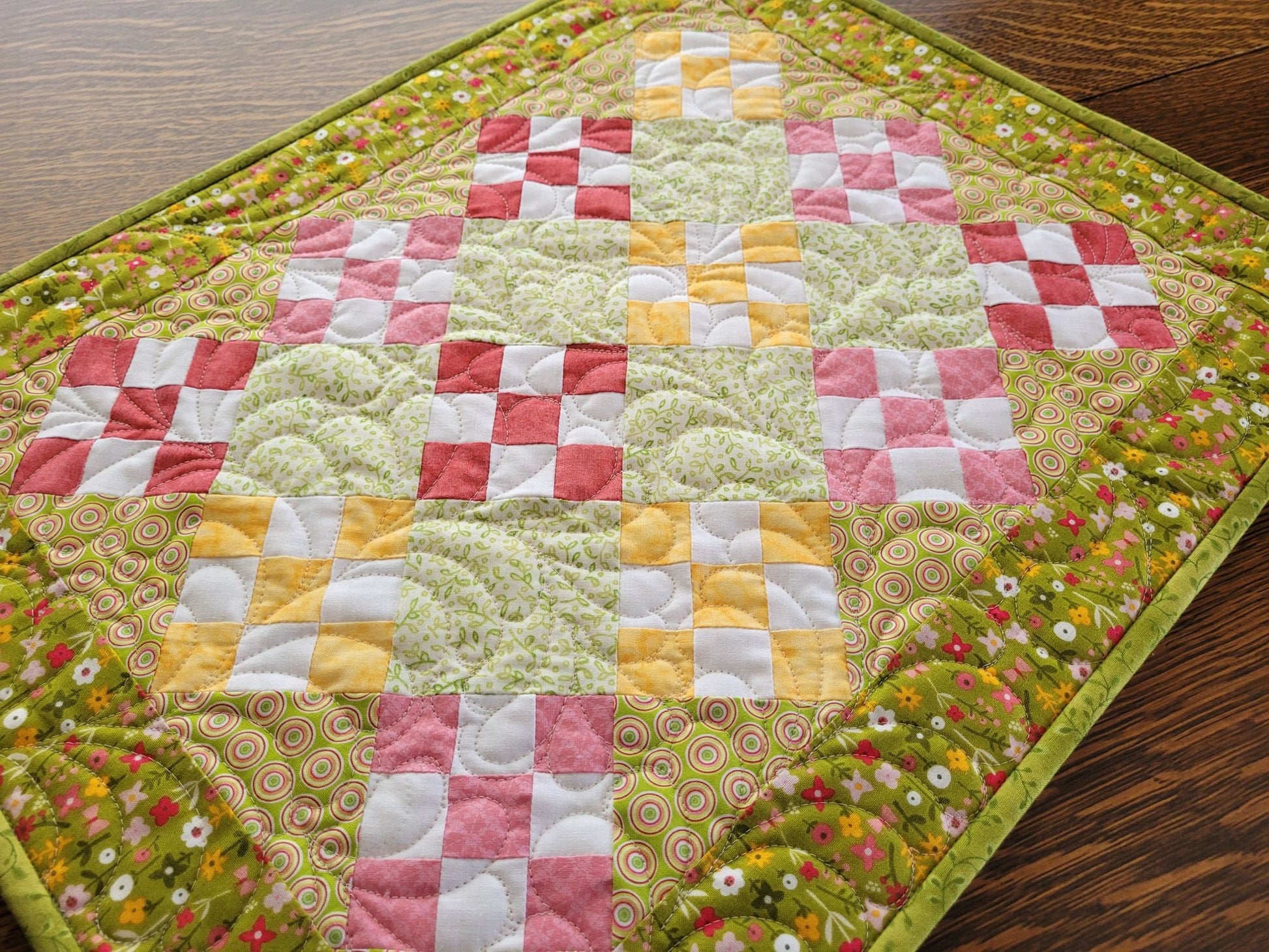 summer floral quilt in green, pink and yellow