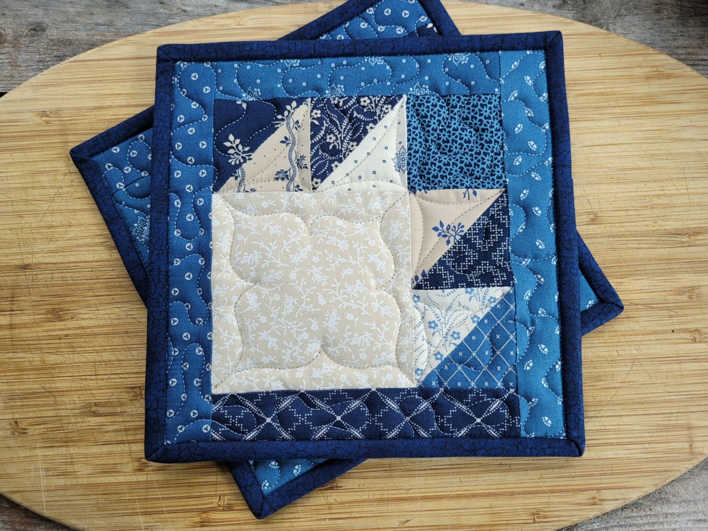quilted potholder in blue bear paw design