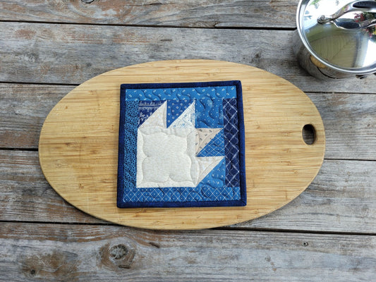 quilted potholder in blue bear paw design