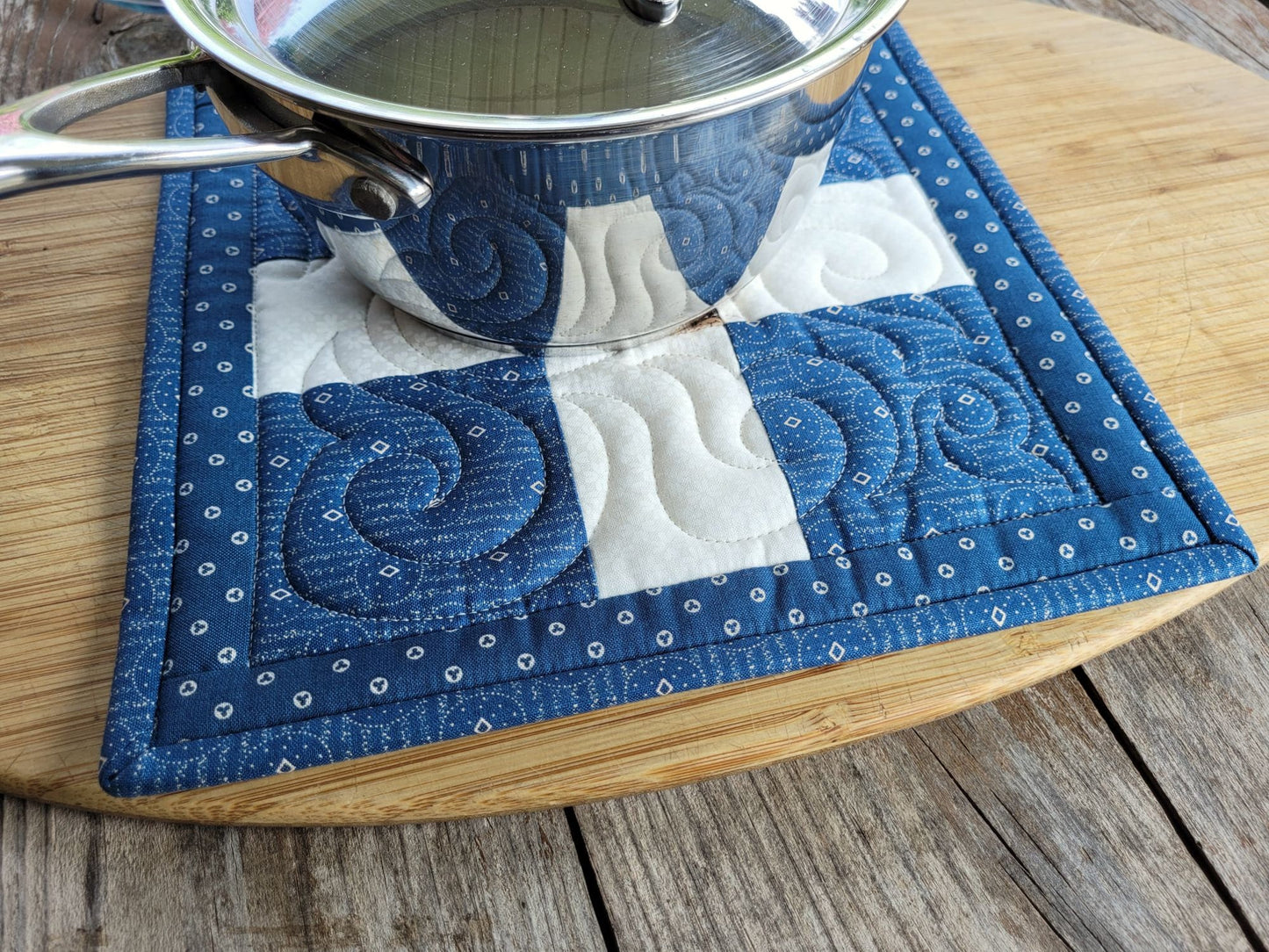 large quilted potholder under small size saucepan