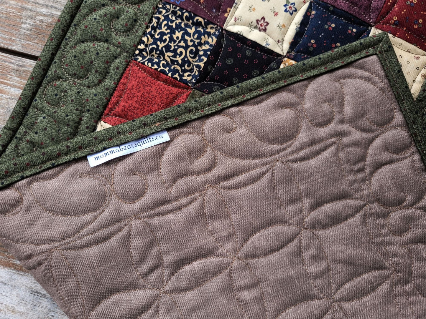 showing back of quilted table runner