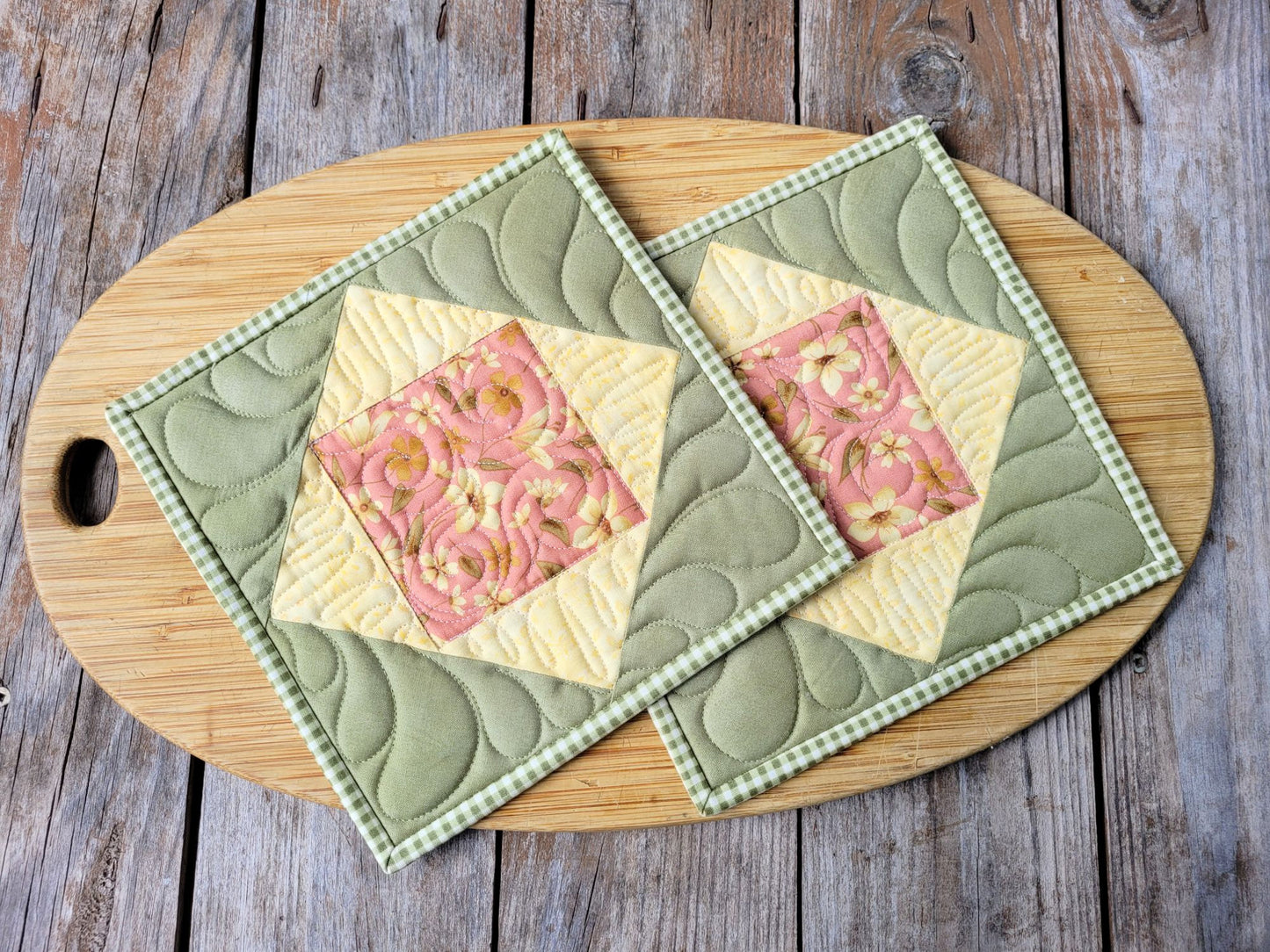 quilted potholders in green and yellow cotton prints