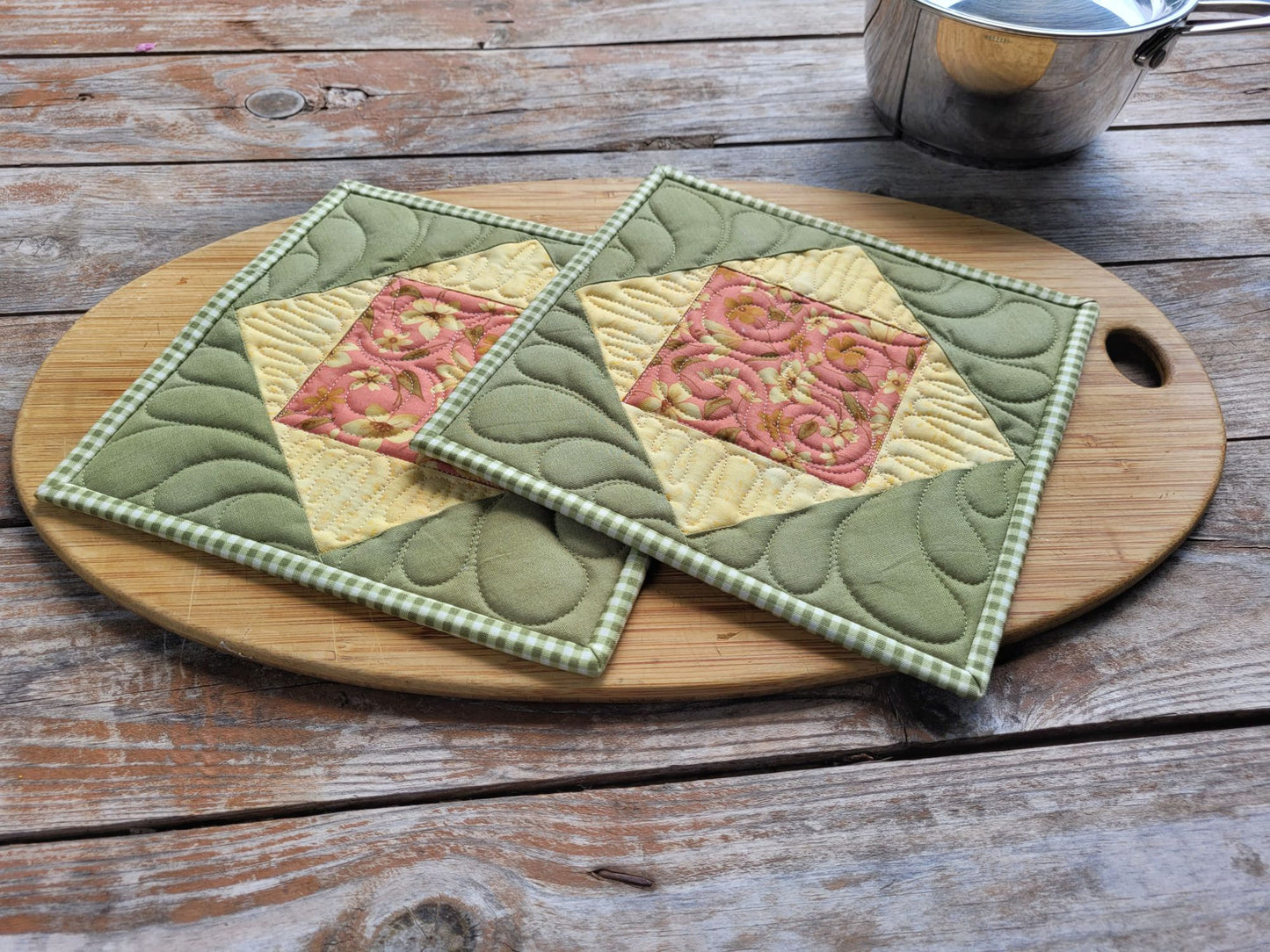 quilted potholders in green and yellow cotton prints