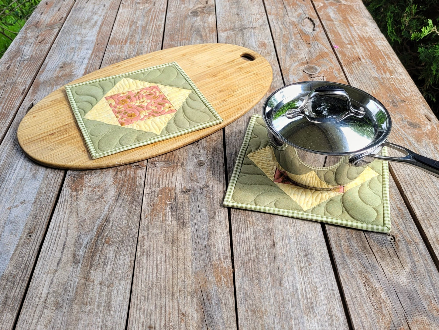 quilted pot mat shown under a small size saucepan