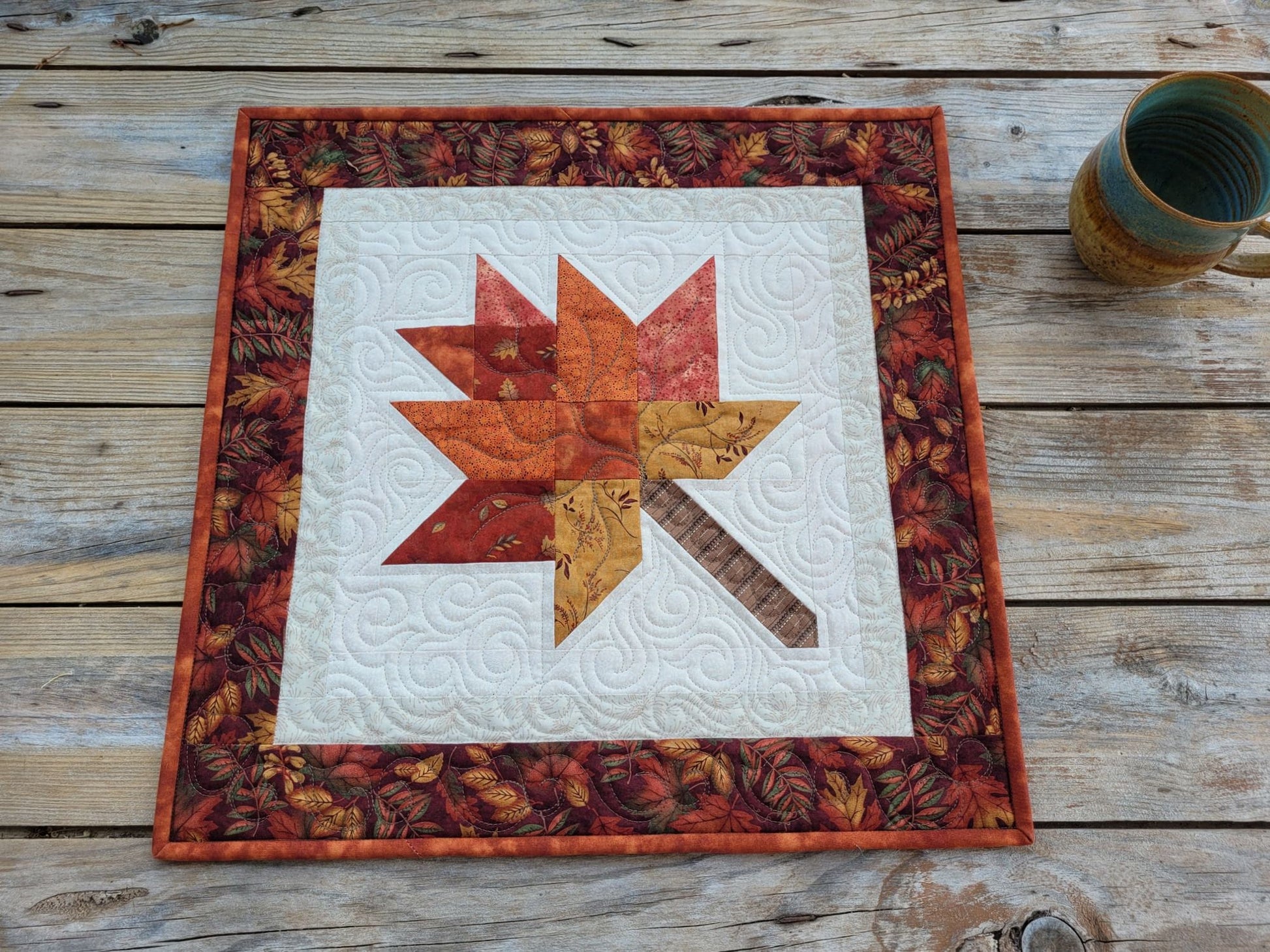 quilted table runner with fall leaves