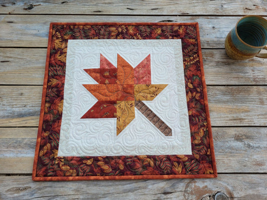 quilted table runner with fall leaves