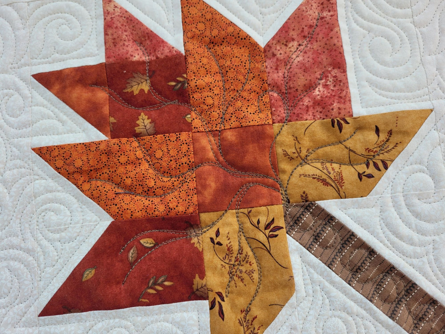 quilted scrappy leaf in fall colors