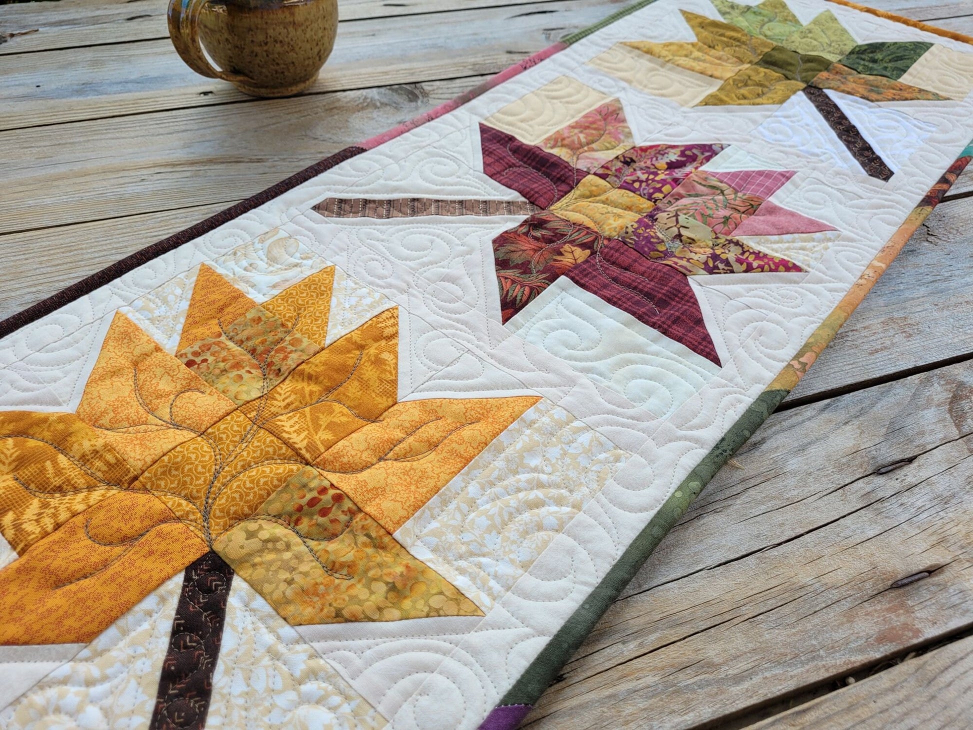 quilted table runner with fall leaves