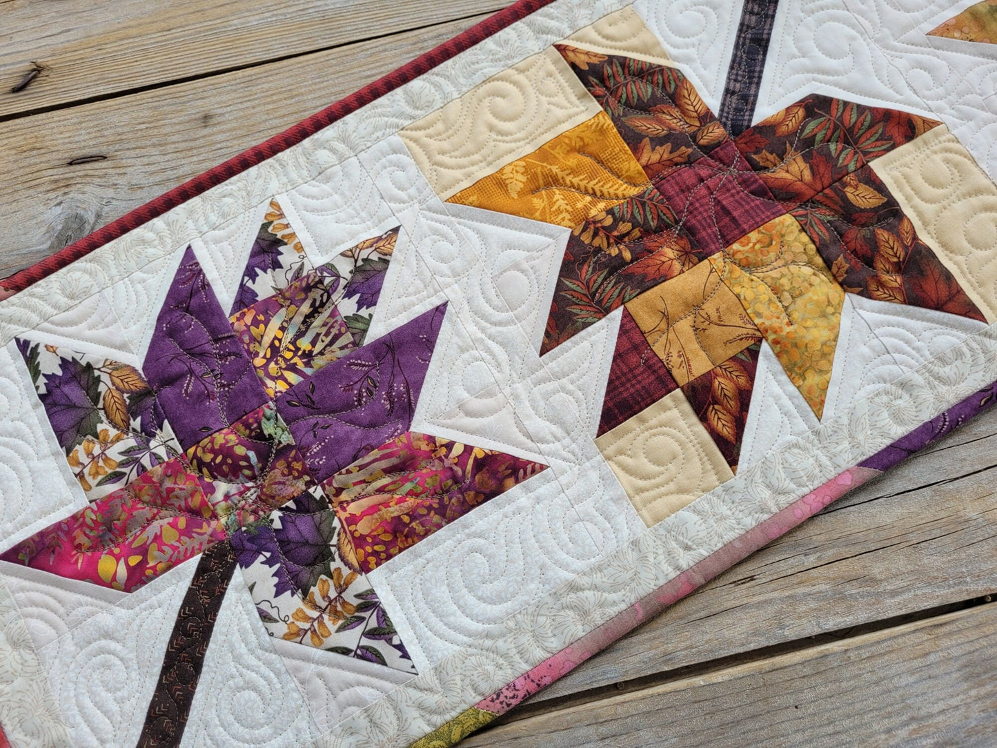 quilted table runner with fall leaves