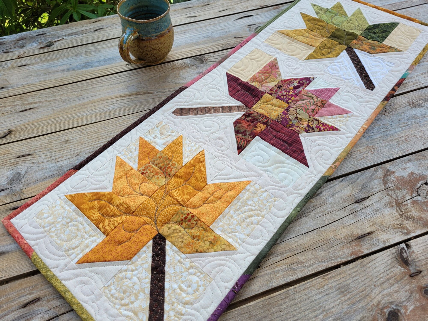 quilted table runner with fall leaves