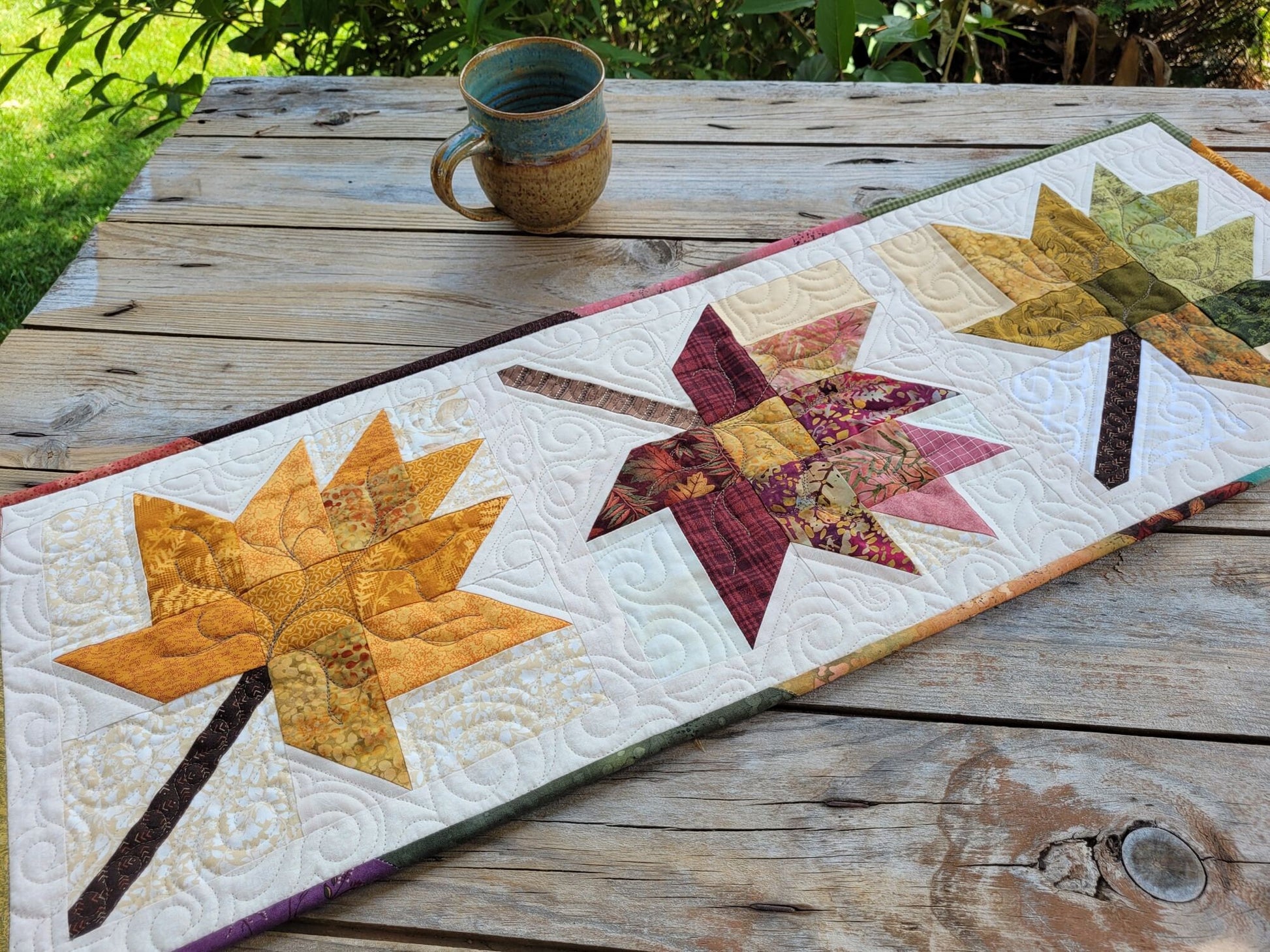 quilted table runner with fall leaves