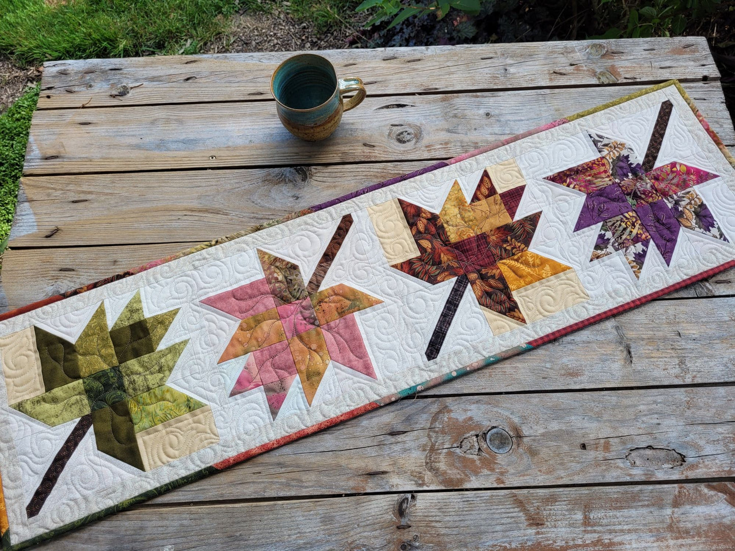 quilted table runner with fall leaves