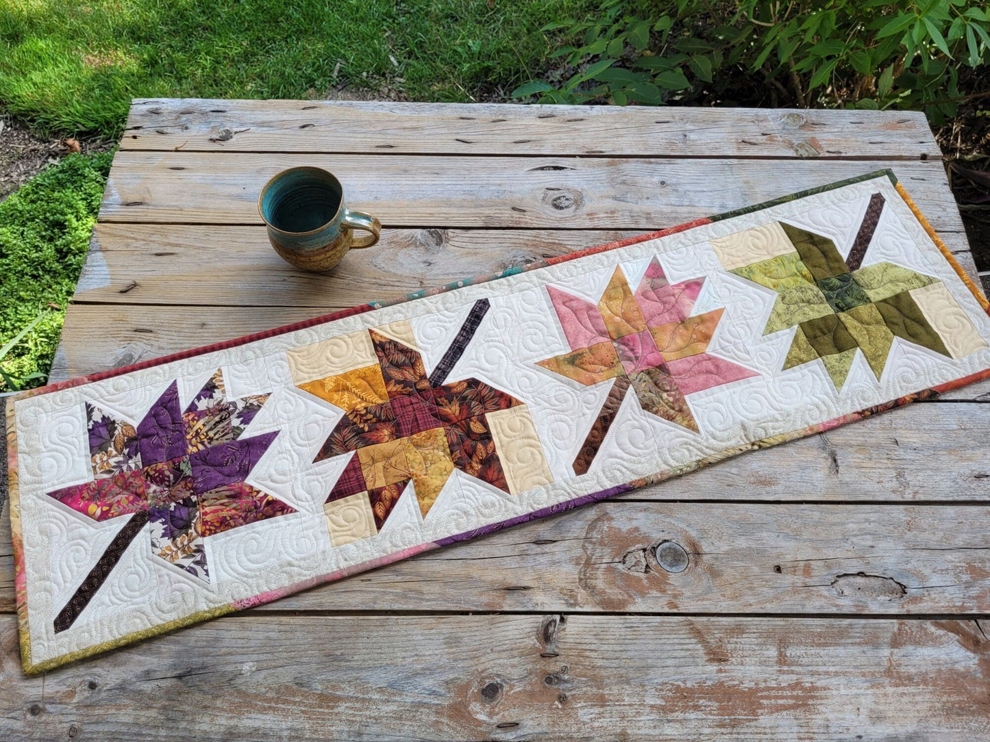 quilted table runner with fall leaves