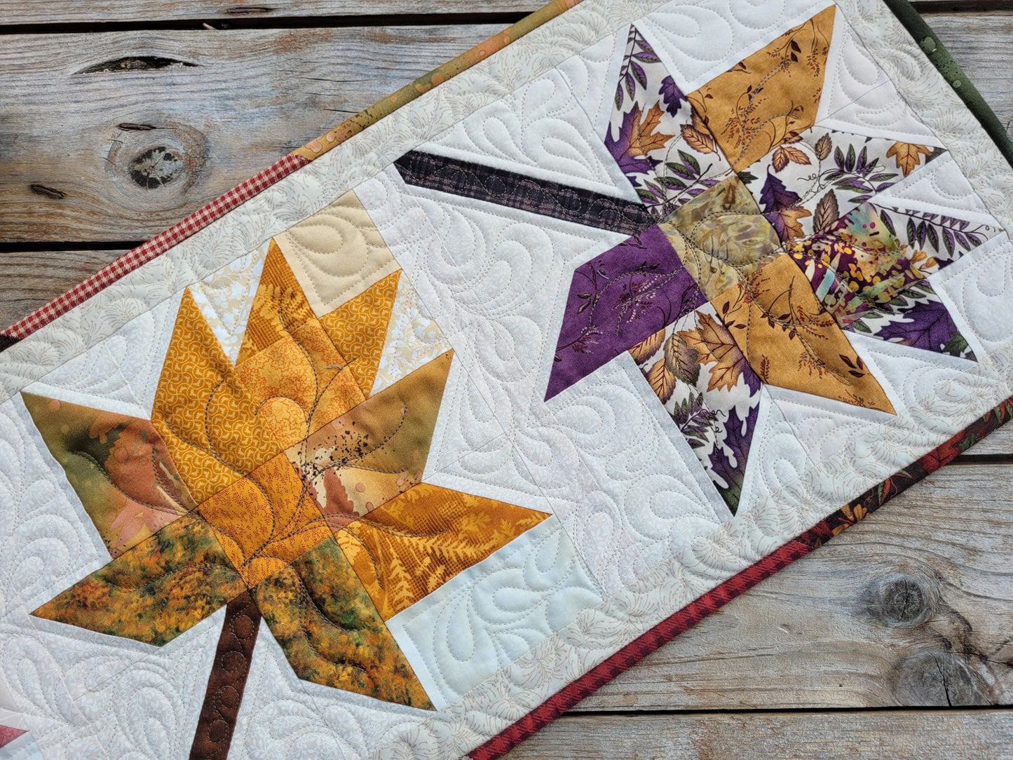 quilted table runner with fall leaves