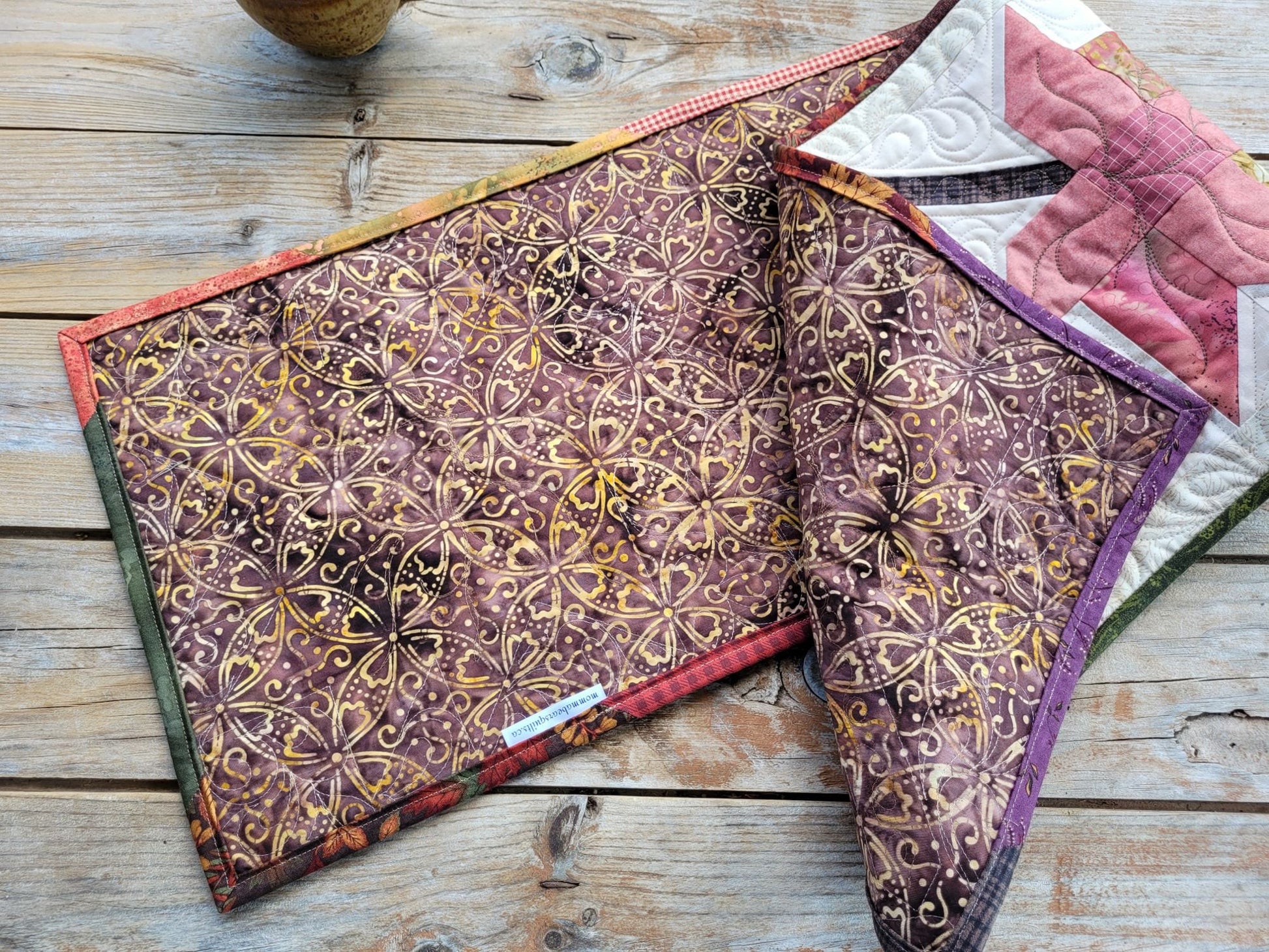 back of quilted table runner and scrappy binding