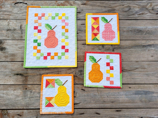 mini wall quilts in colorful scrappy patchwork pear fruit