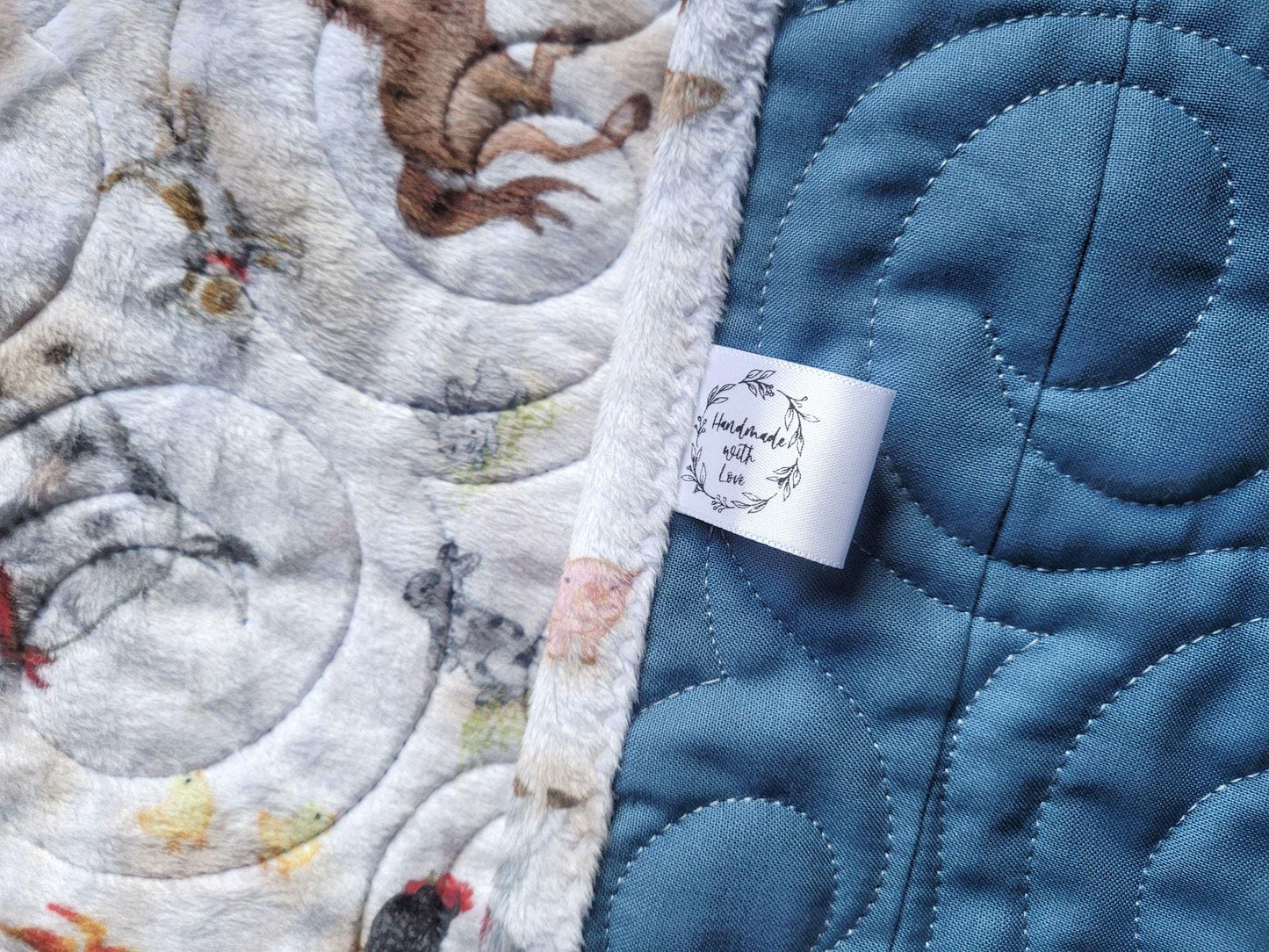 handmade label and soft minky backing of baby quilt