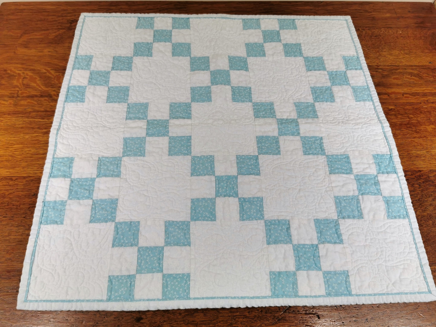 blue and white nine patch quilt square with flanged binding