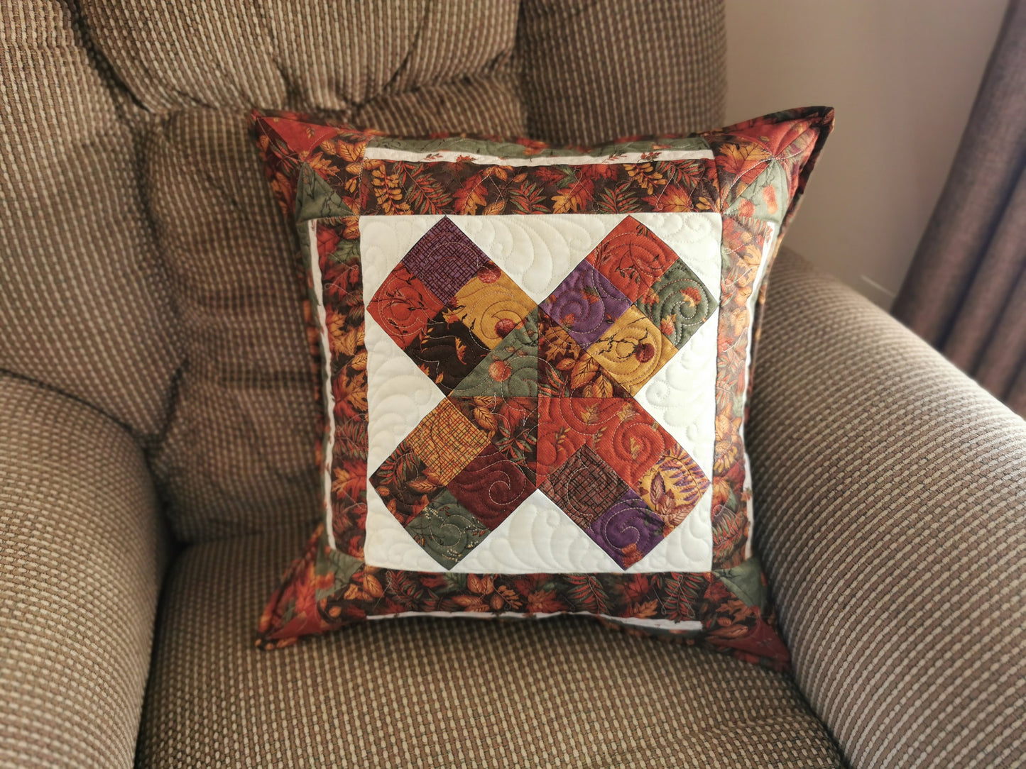 front view of pillow sitting on a lazyboy