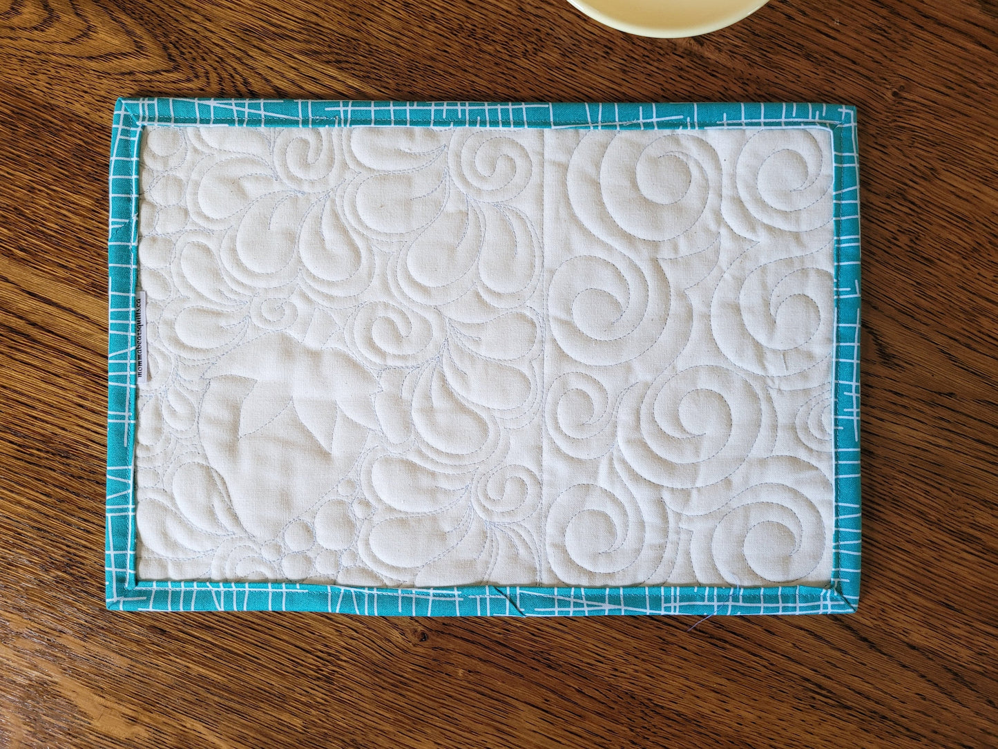 showing back of mini quilt
