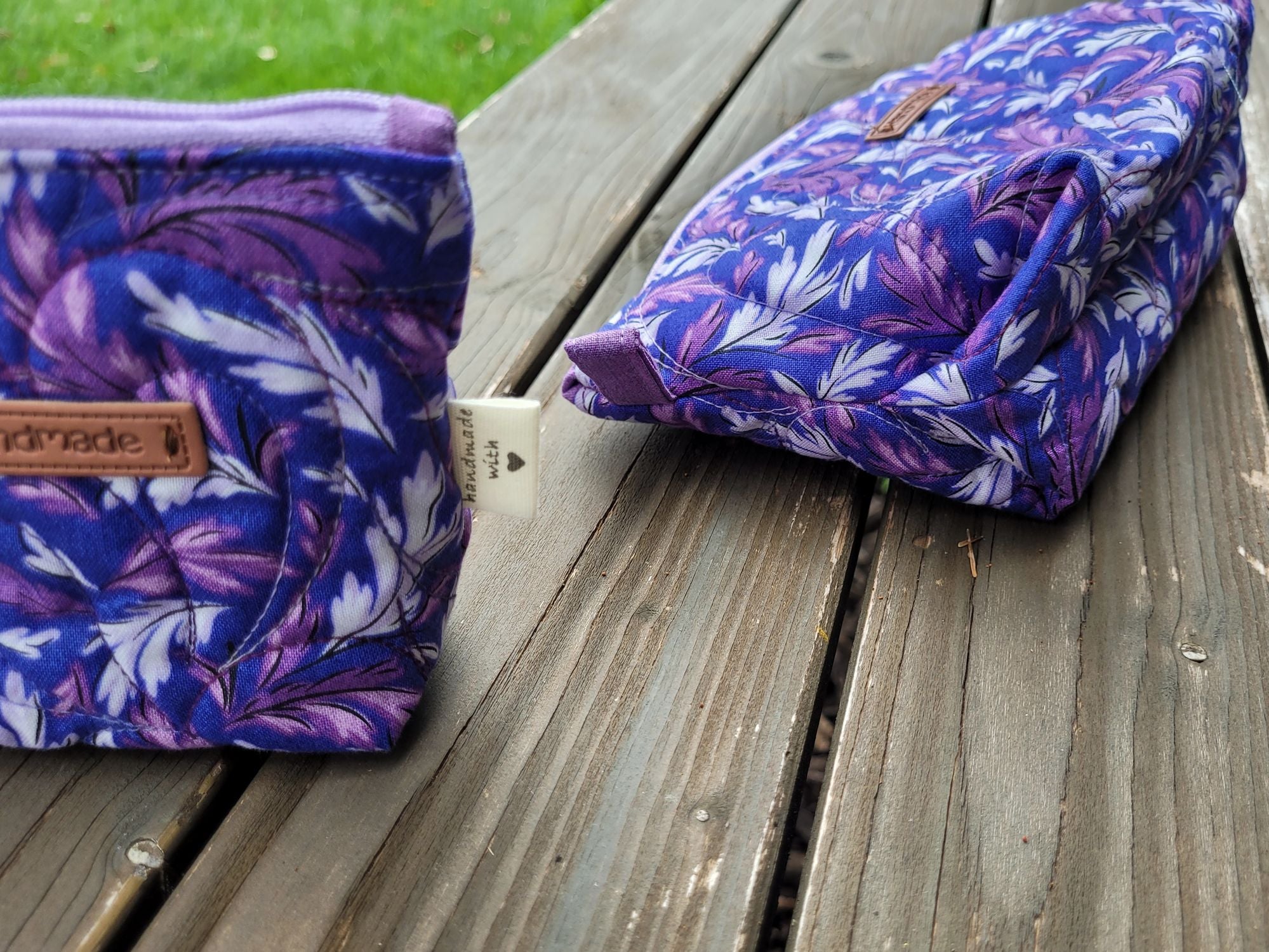zipper pouches in purple leaf fabric