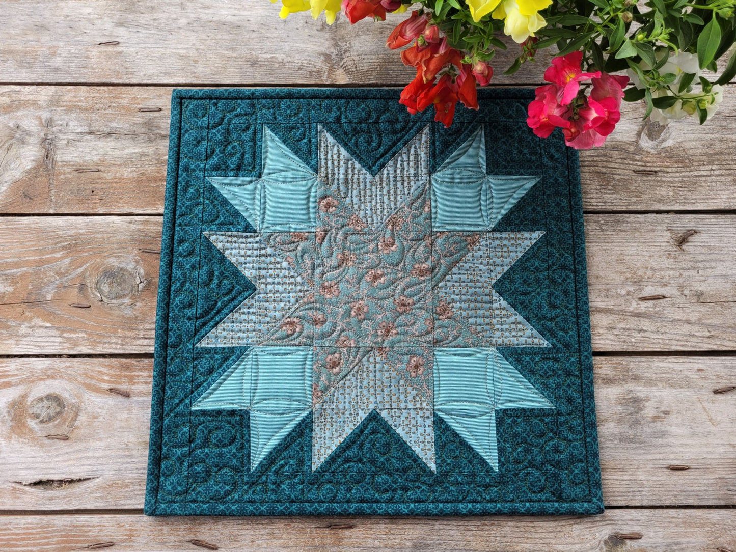 Patchwork star mini quilt in teal and brown 