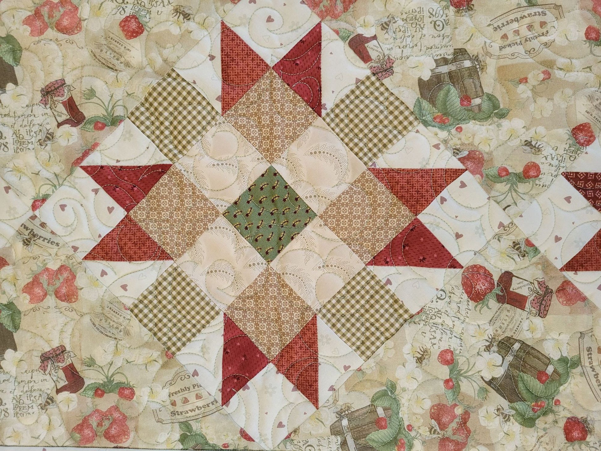 strawberry quilted table runner in close up of patchwork star block