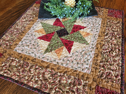 Quilt with a star pattern on a wooden surface