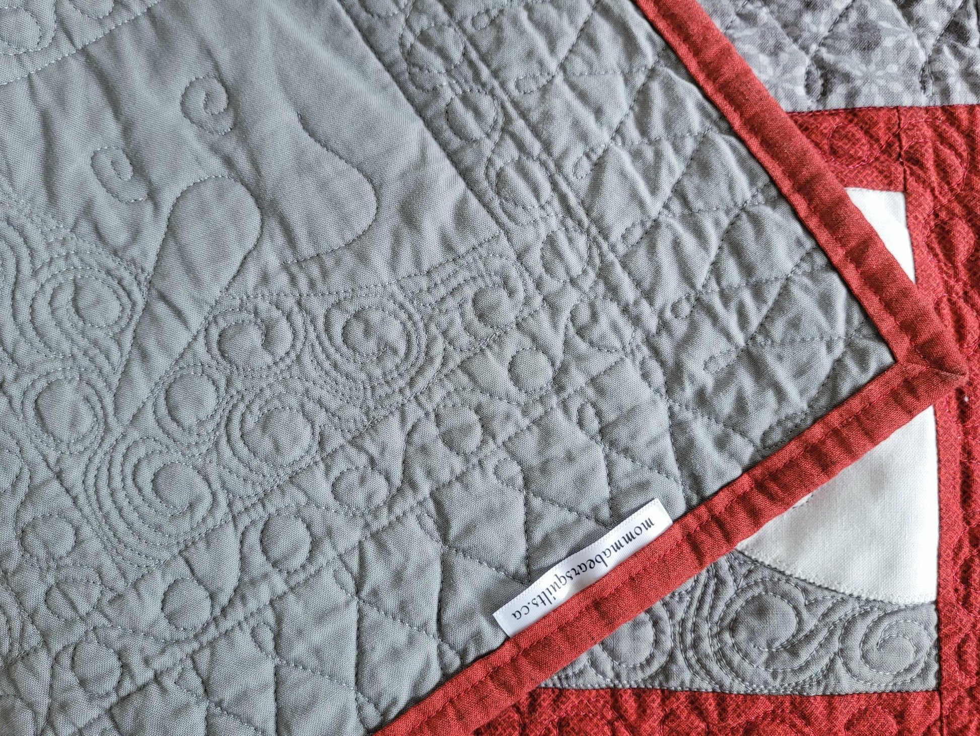 Showing back of snowman runner with brand label.