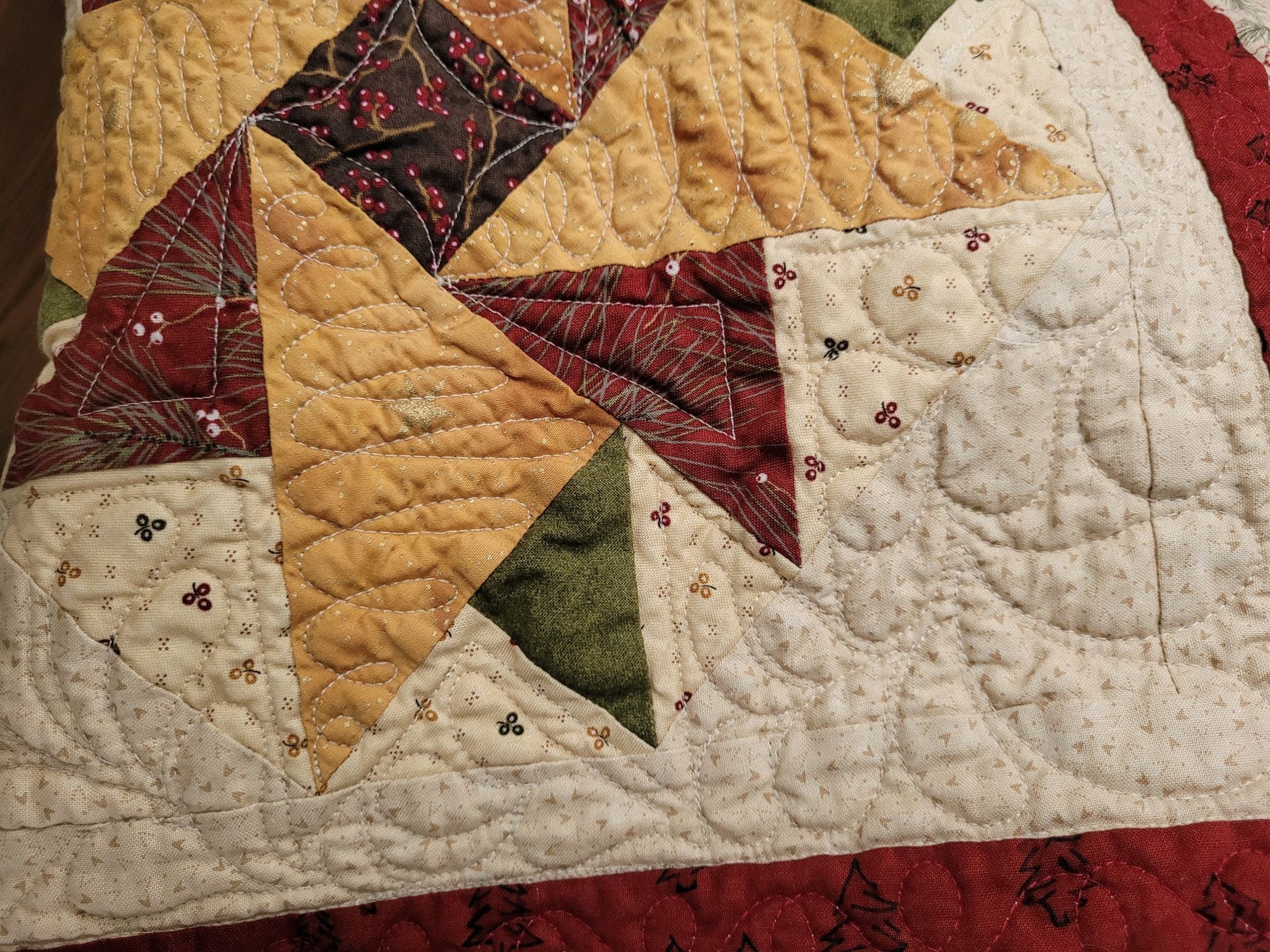 Patchwork quilt with star pattern on a beige background
