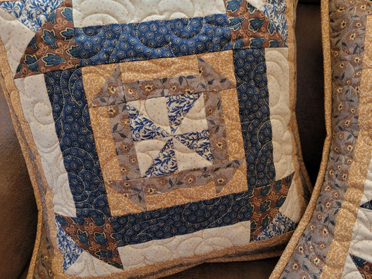 Churn 'n' Dash patchwork quilted pillow in blue, brown and cream. 