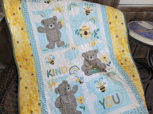 Blue and yellow baby quilt with bears and bees.