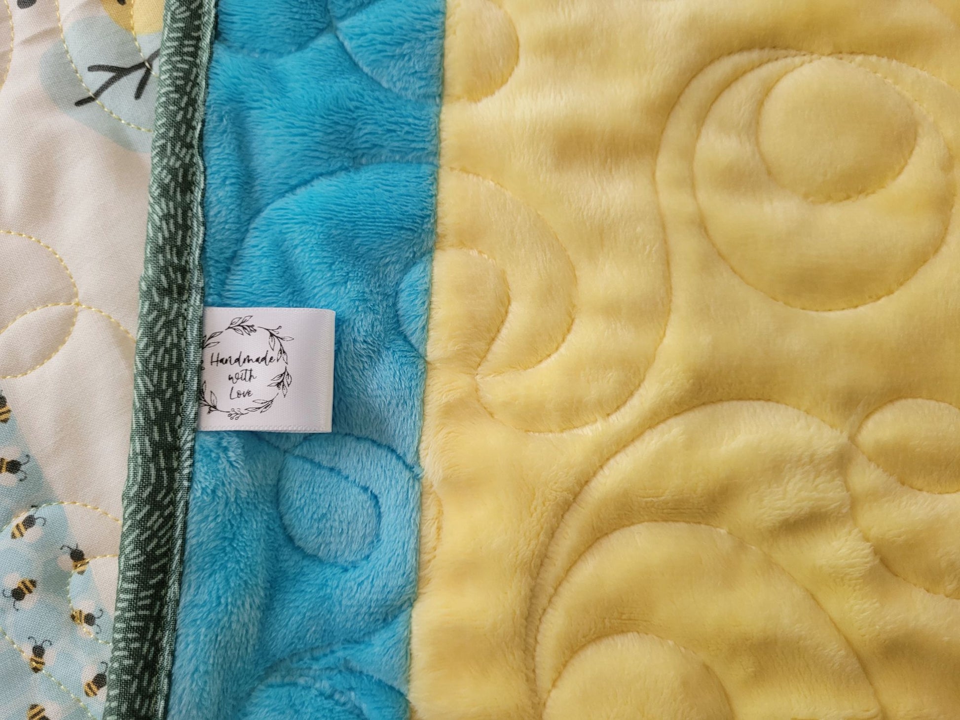 Close up of the soft minky back and the Handmade with Love label.