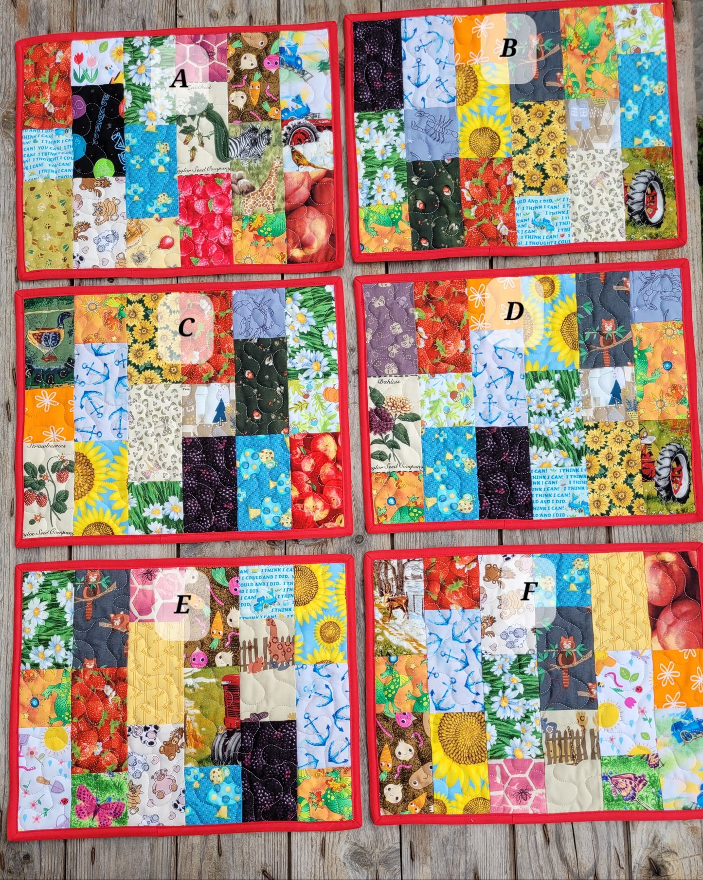 Six colorful patchwork quilts labeled A through F arranged in a 3-by-2 grid on a rustic wooden surface. Each quilt features a patchwork design with various fruit, floral, and nature-themed fabrics, finished with a red border.