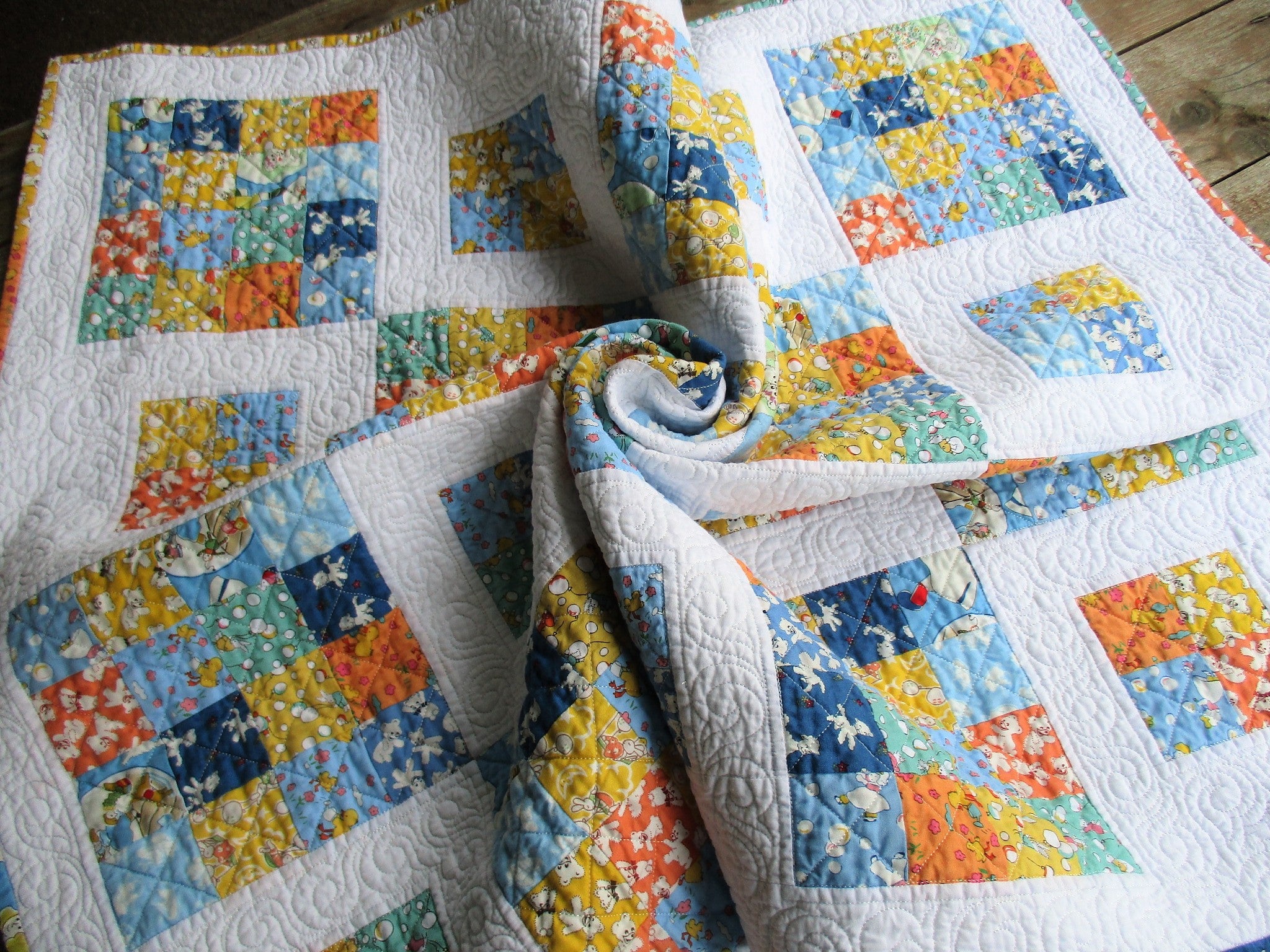 Patchwork baby quilts made with quality and care. Find one-of-a-kind creations at Momma Bears Quilts.