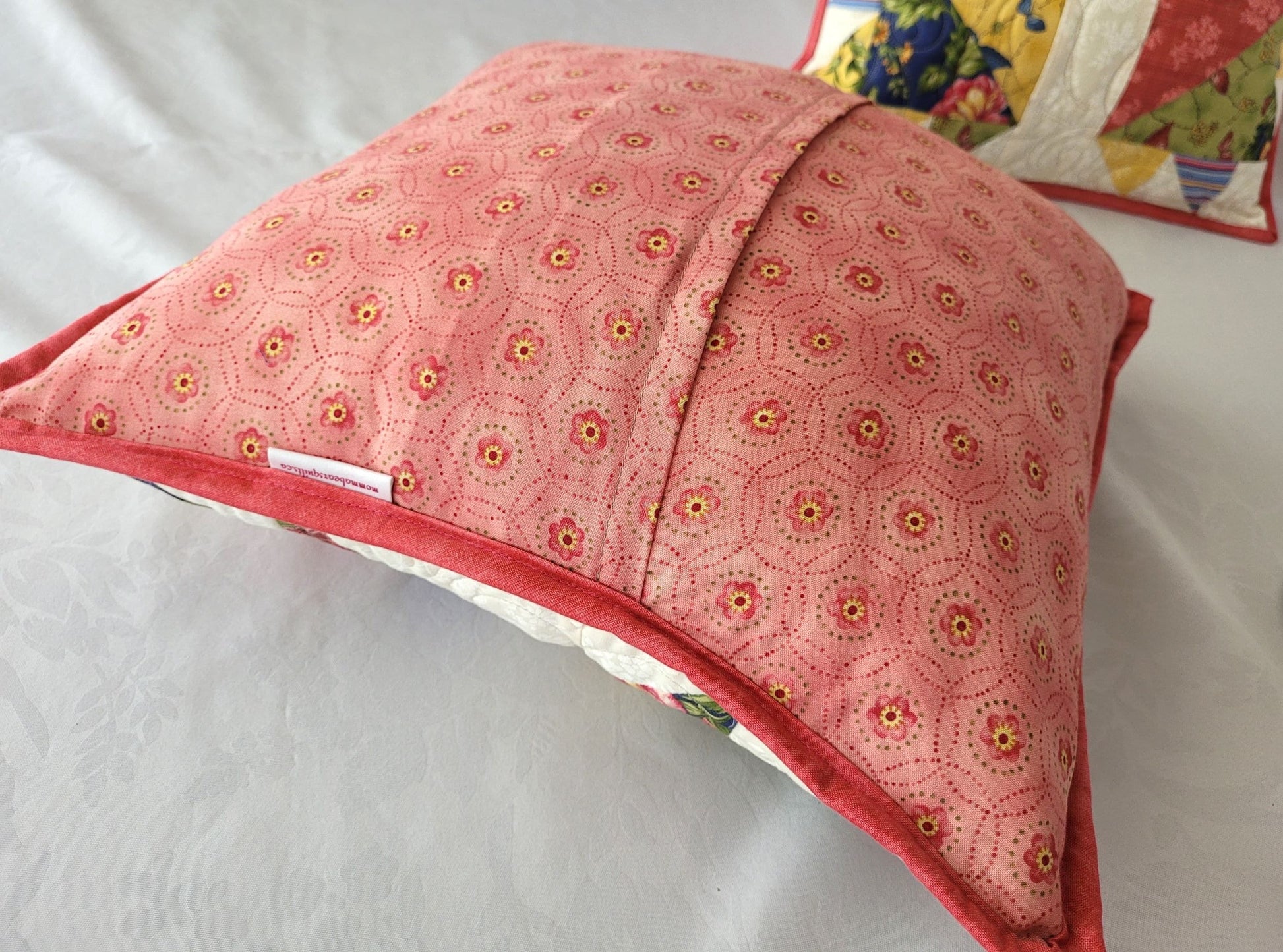 coral pink floral overlapping back on bear paw throw pillow