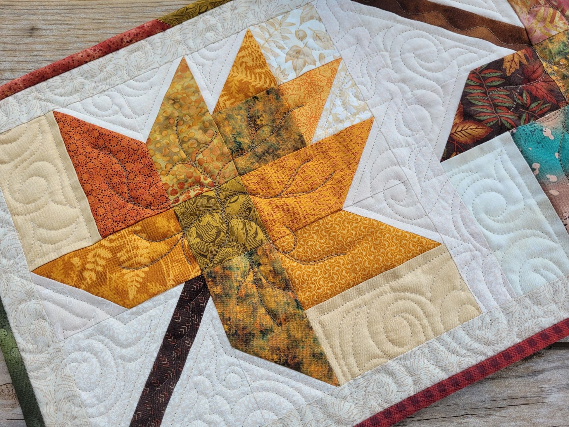 quilted table runner with fall leaves