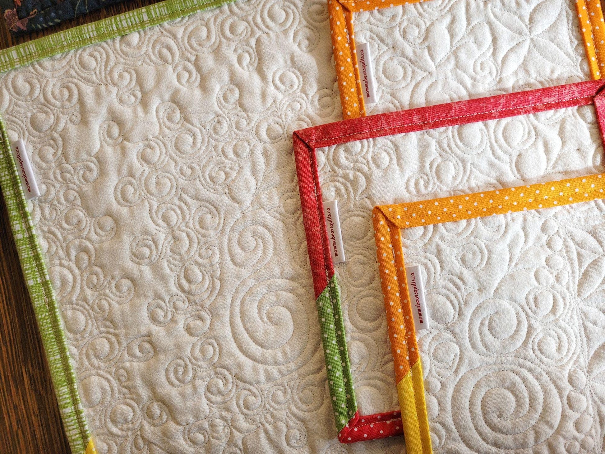 showing back of mini quilts