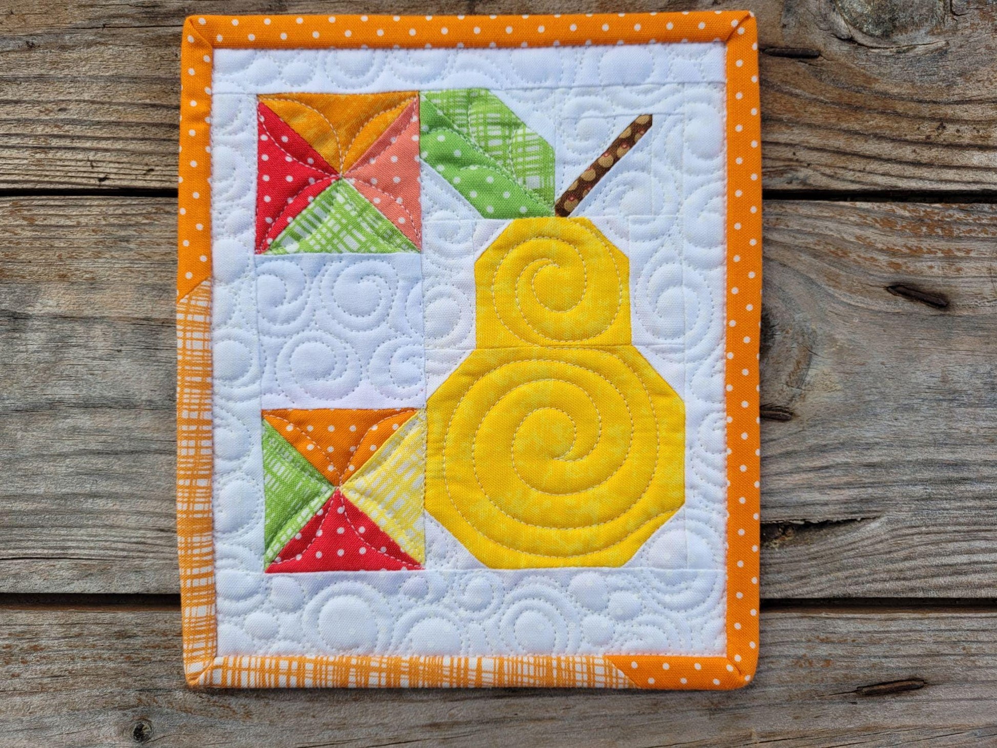mini scrap quilt with yellow patchwork pear