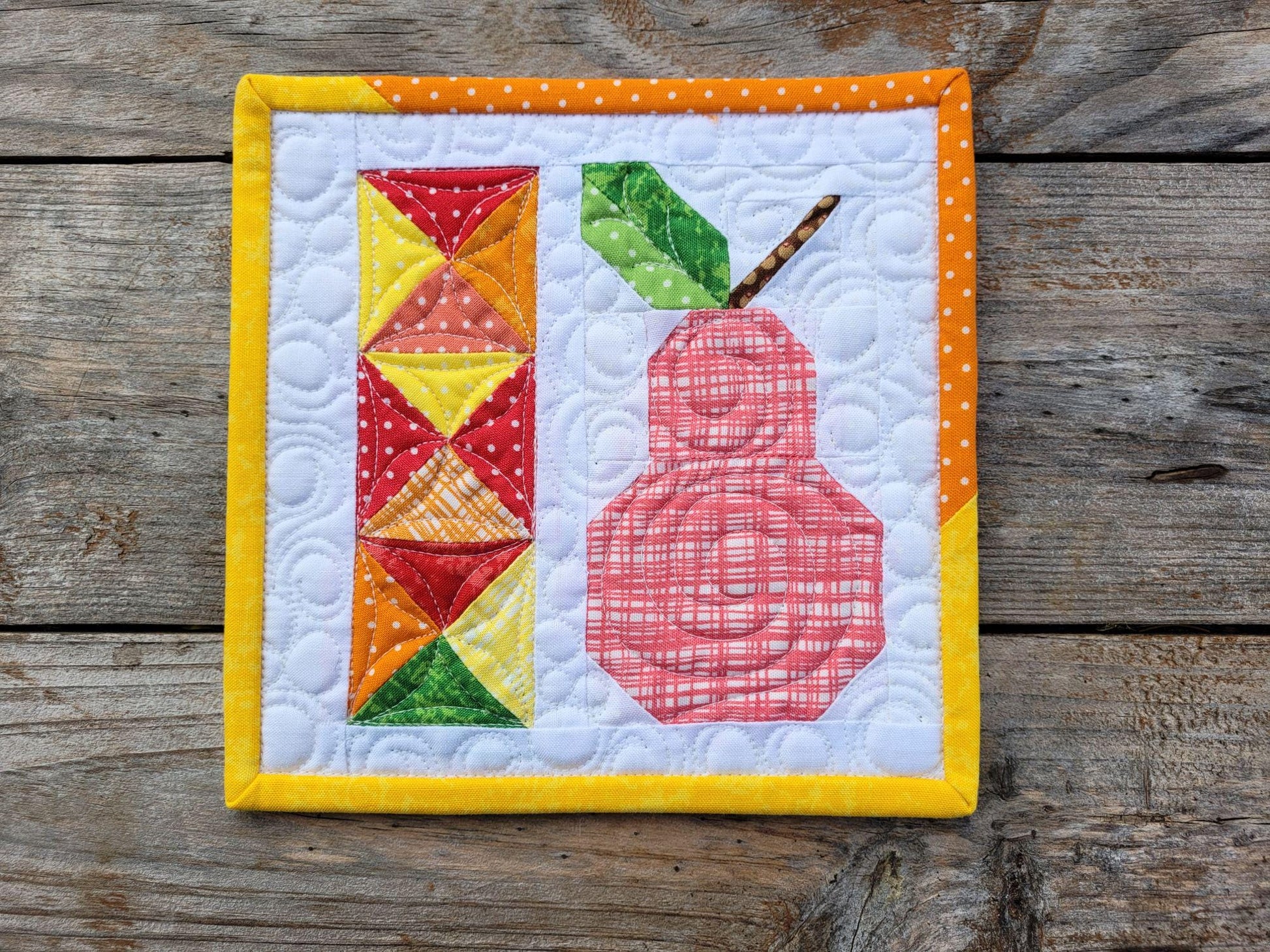 mini scrap quilt with pink patchwork pear