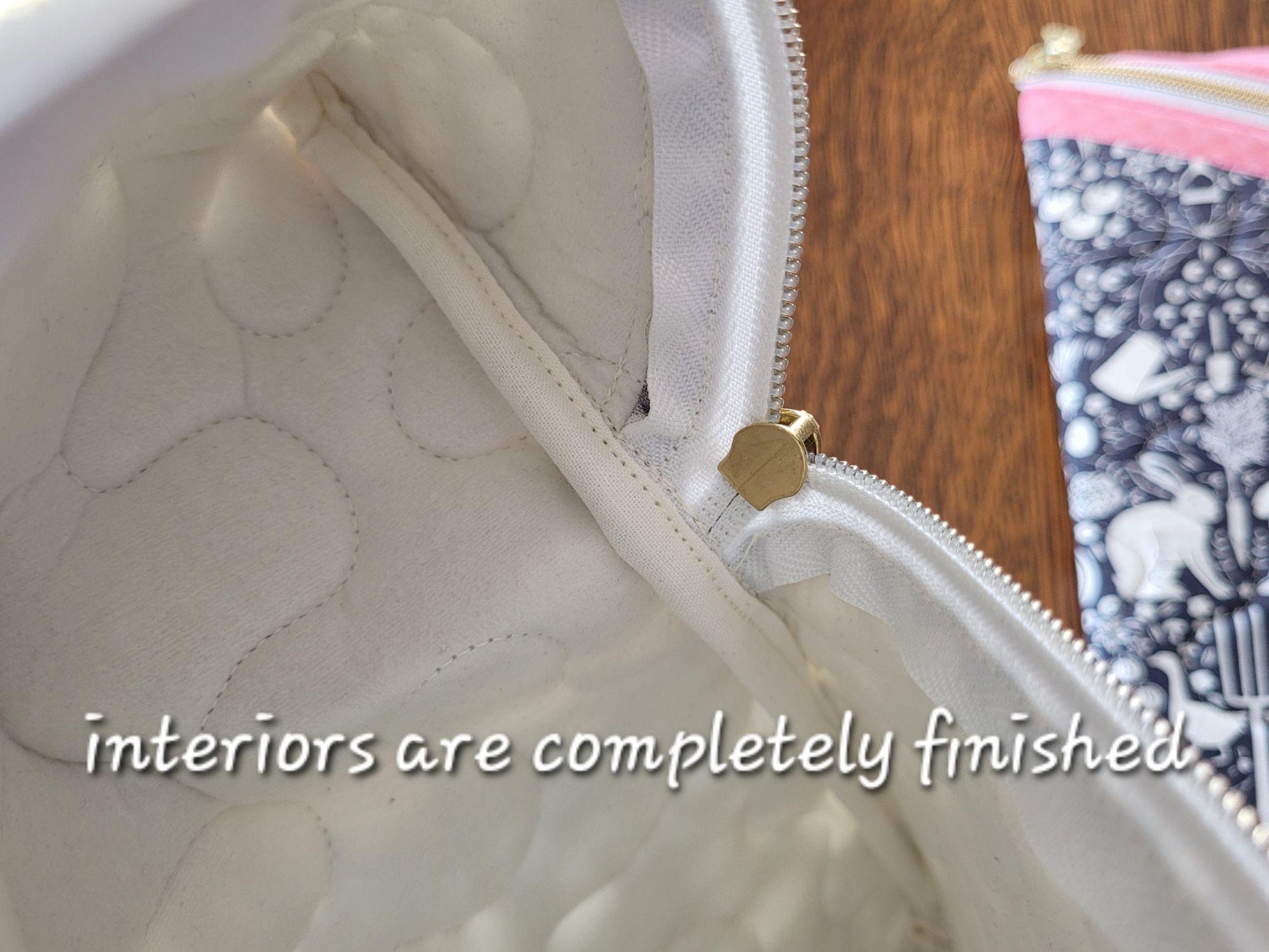 Showing inside of zipper pouch with enclosed seams.