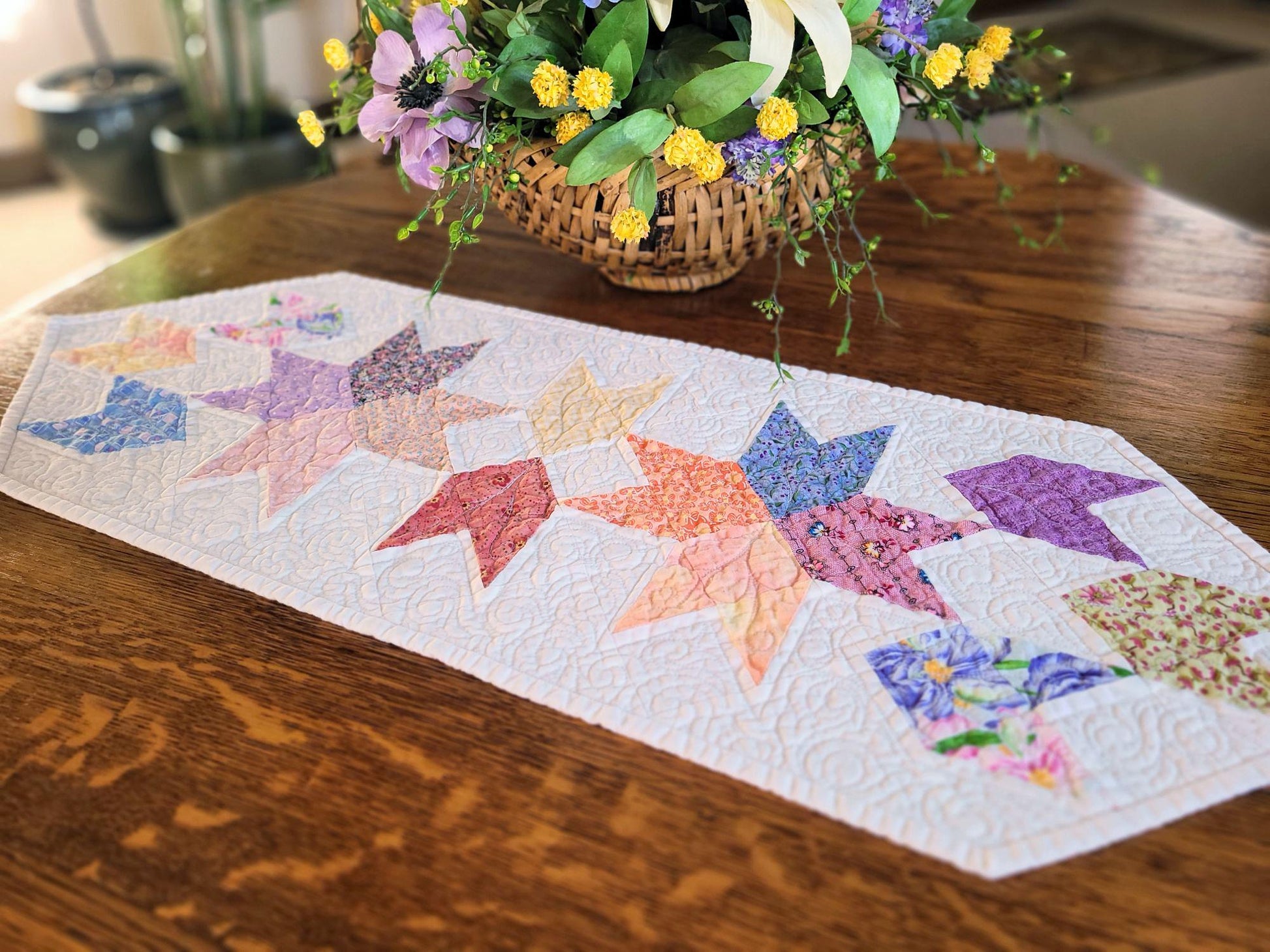 Spring tulip table runner on wood table with flower basket.
